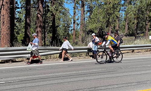 A group of pedestrians walking along U.S. 50 in a dangerous area